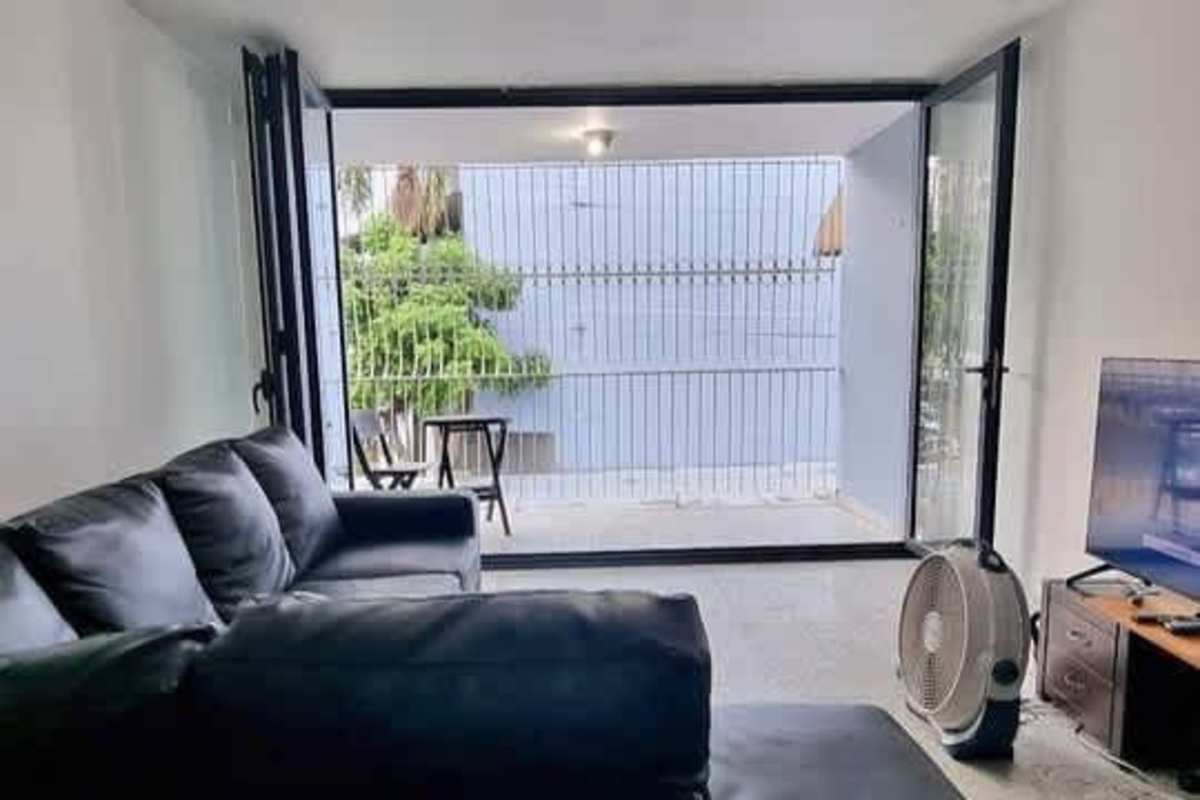 Open kitchen with granite counters and new cabinetry at PH Palmas Bellas Parque Lefevre Panama