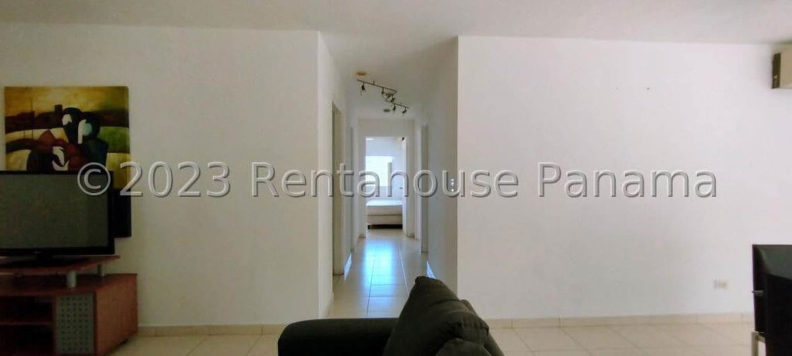 Kitchen with granite countertops, wood cabinets, stove, refrigerator in PH Costa Pacifica Panama City