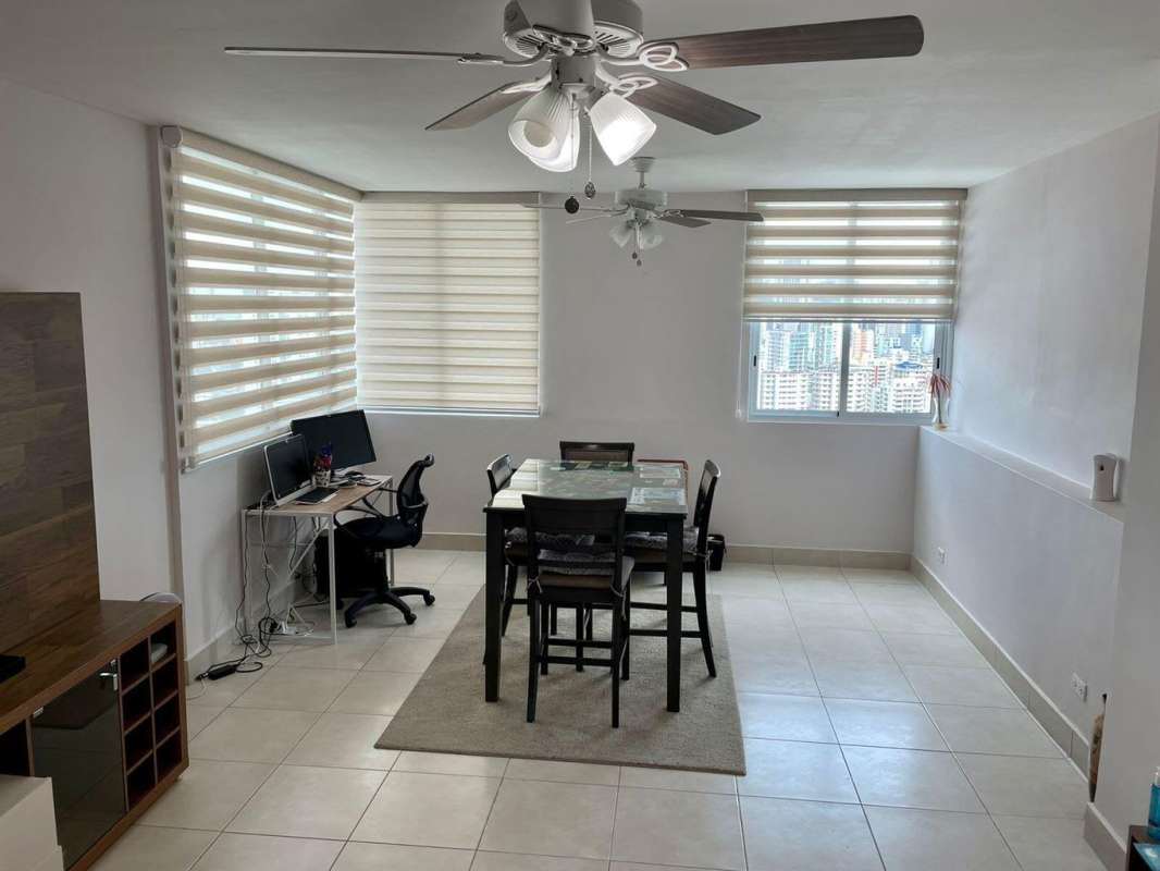 Living dining area with ceiling fans large windows zebra blinds in PH Vivendi Towers Edison Park Panama City
