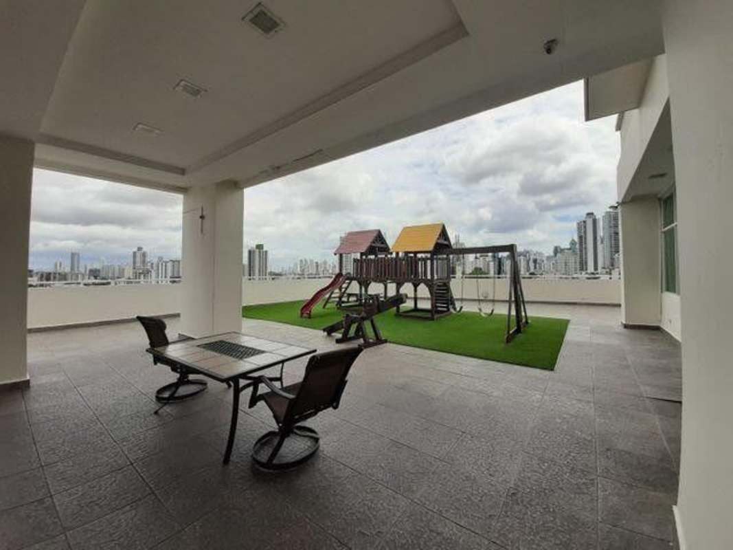 Covered terrace with children playground city skyline view at PH Vivendi Towers Edison Park Panama