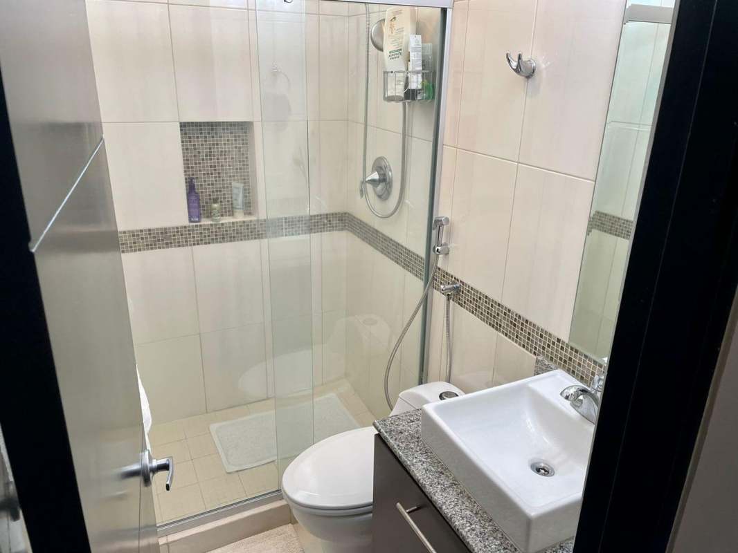 Bathroom with glass shower enclosure granite countertop vessel sink PH Vivendi Towers Panama