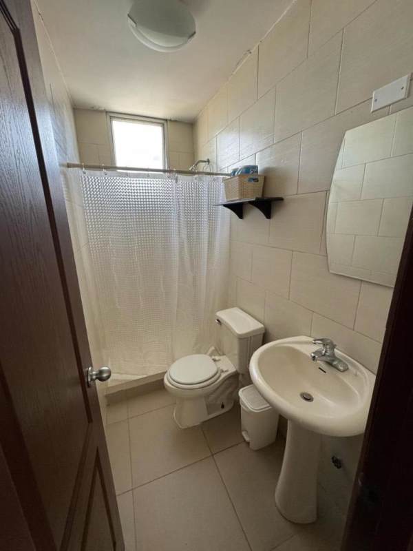 Bedroom with large window, city view horizon, AC unit in PH Metric Panama City