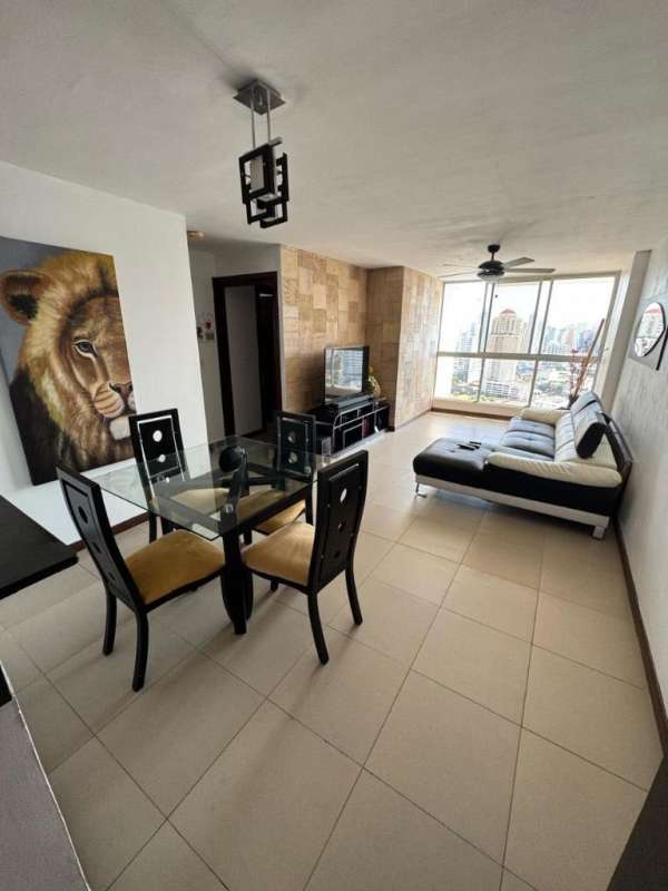 Living dining with large windows, skyline city views at PH Metric Vía Brasil Panama City