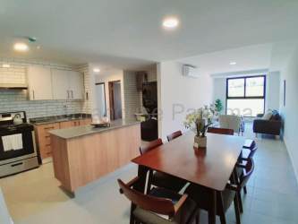 Contemporary kitchen light wood cabinets white tile backsplash The District Costa Verde Panama