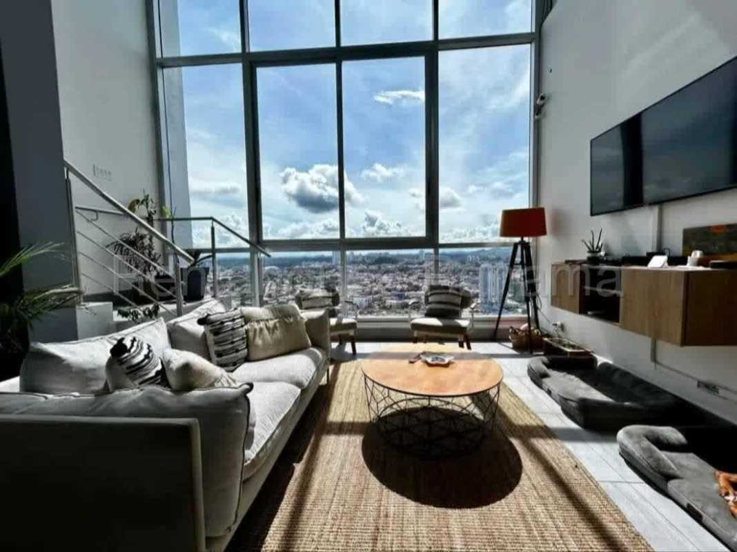 Loft living space with large windows featuring Panama City skyline modern design PH Vista Loft Panama