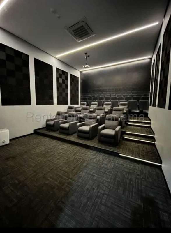 Private cinema with recliner seats projector and surround sound in Vista Loft building for residents