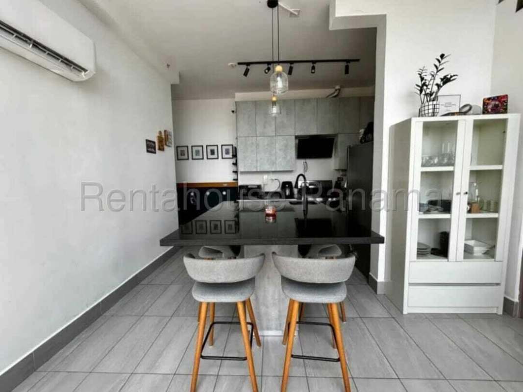 Contemporary kitchen with island bar and pendant lighting in PH Vista Loft Panama for rent