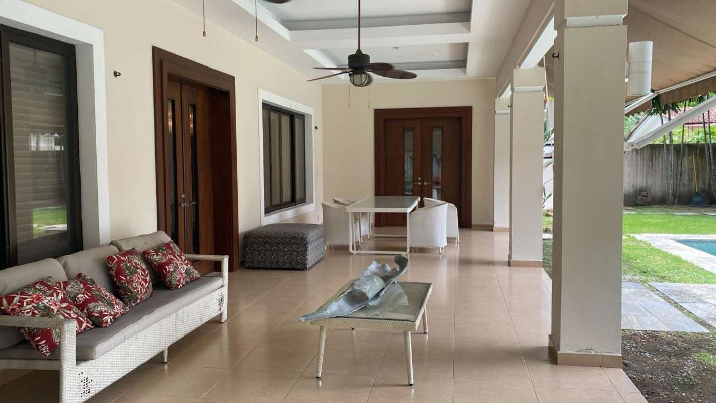 Private swimming pool with integrated jacuzzi wooden deck and outdoor kitchenette at PH La Toscana Costa del Este