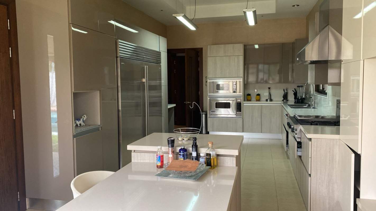 Bright living room with marble floors sectional sofa decorative lighting PH La Toscana Costa del Este Panama