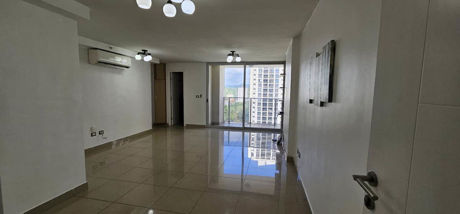 Bedroom with large window, tile floor and closet PH Rokas Condado del Rey Panama City