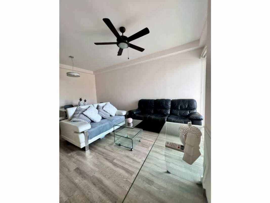 Granite countertop kitchen with stove, ceiling fan, cabinets in PH El Doral Panama City