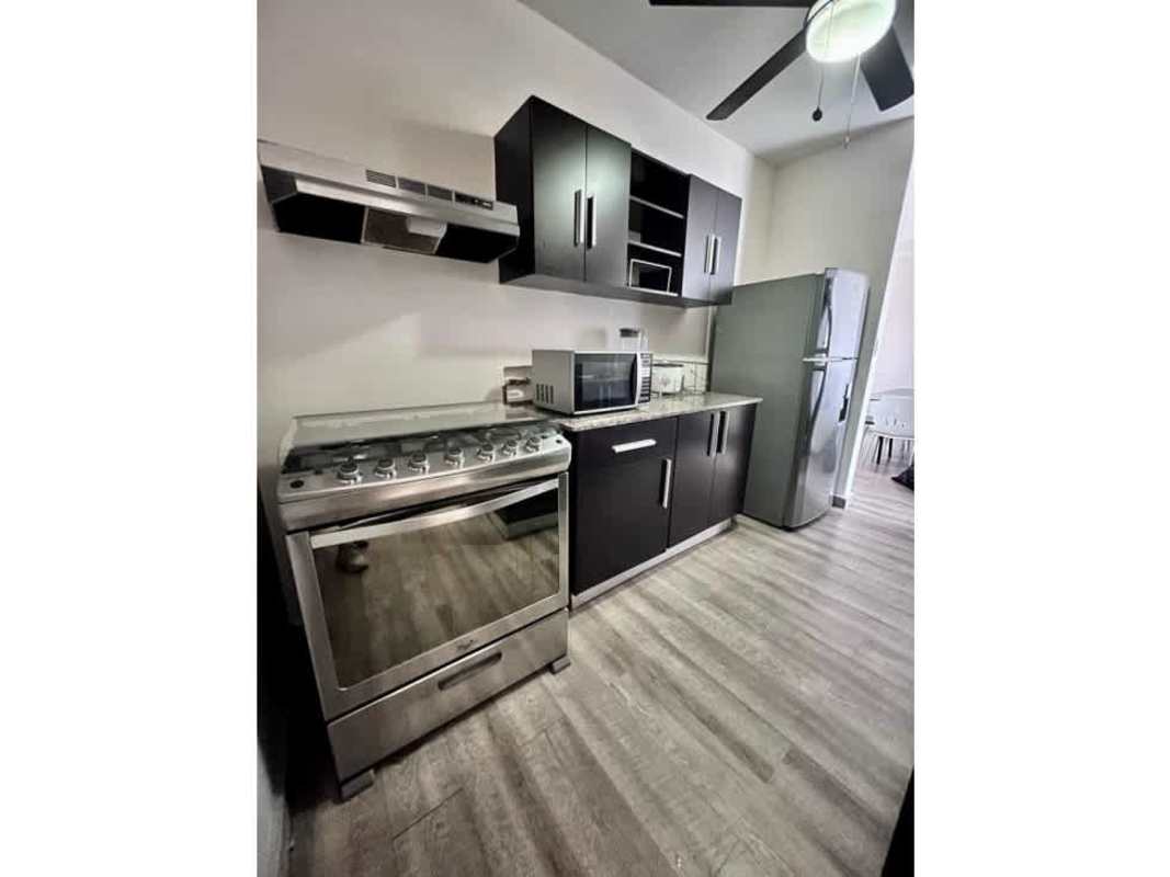 Modern swimming pool with seating area at PH El Doral Panama City