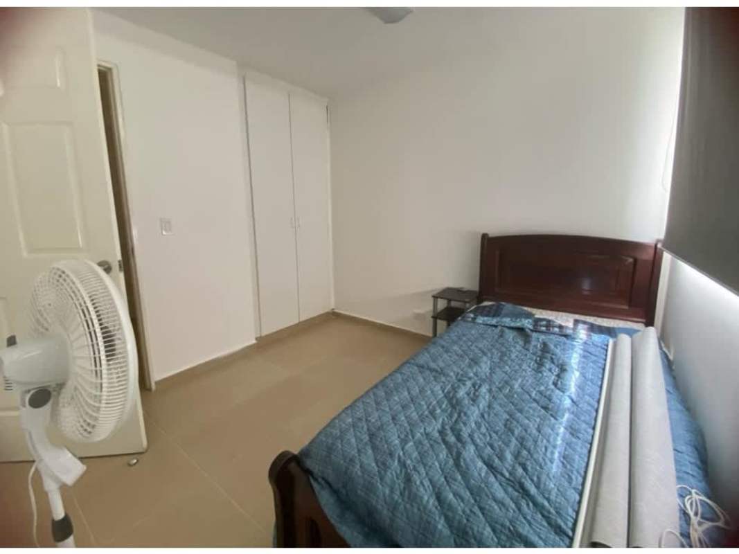 Bedroom with blue bedding built-in closet tile floor Mystic Hills Panama