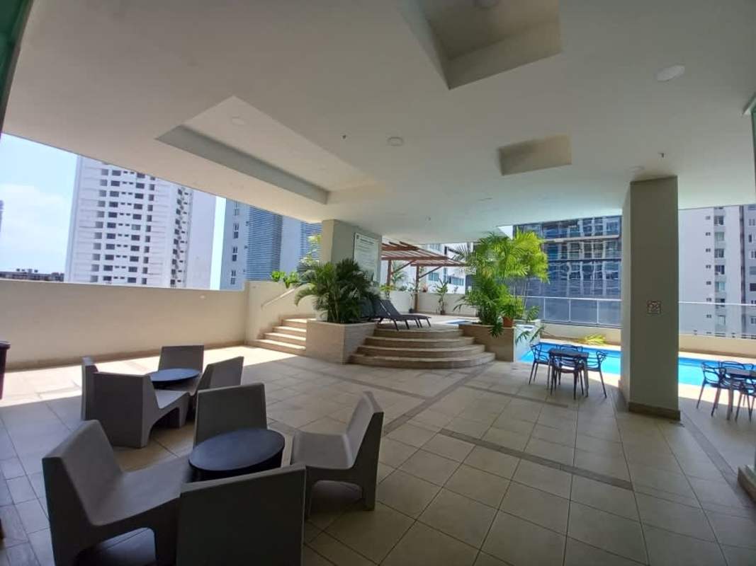 Spacious living room floor-to-ceiling windows panoramic ocean and skyline view PH Bell View Tower Bella Vista Panama