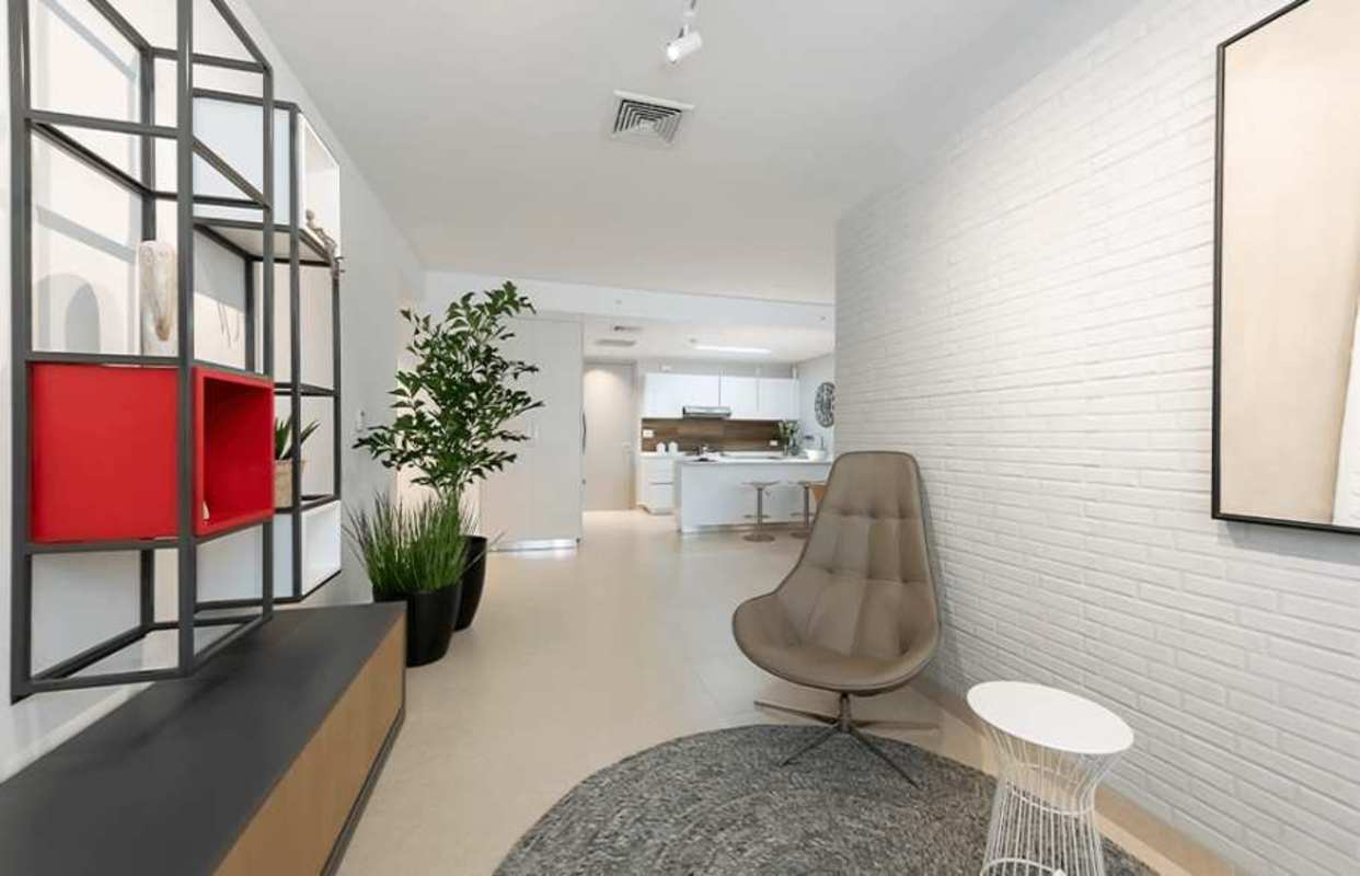 Minimalist modern living room with brick accent wall in PH Cangrejo City View Panama