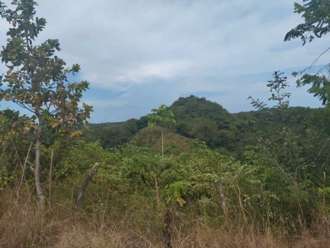 Green hills and blue sky over mountain rural land for sale Panama