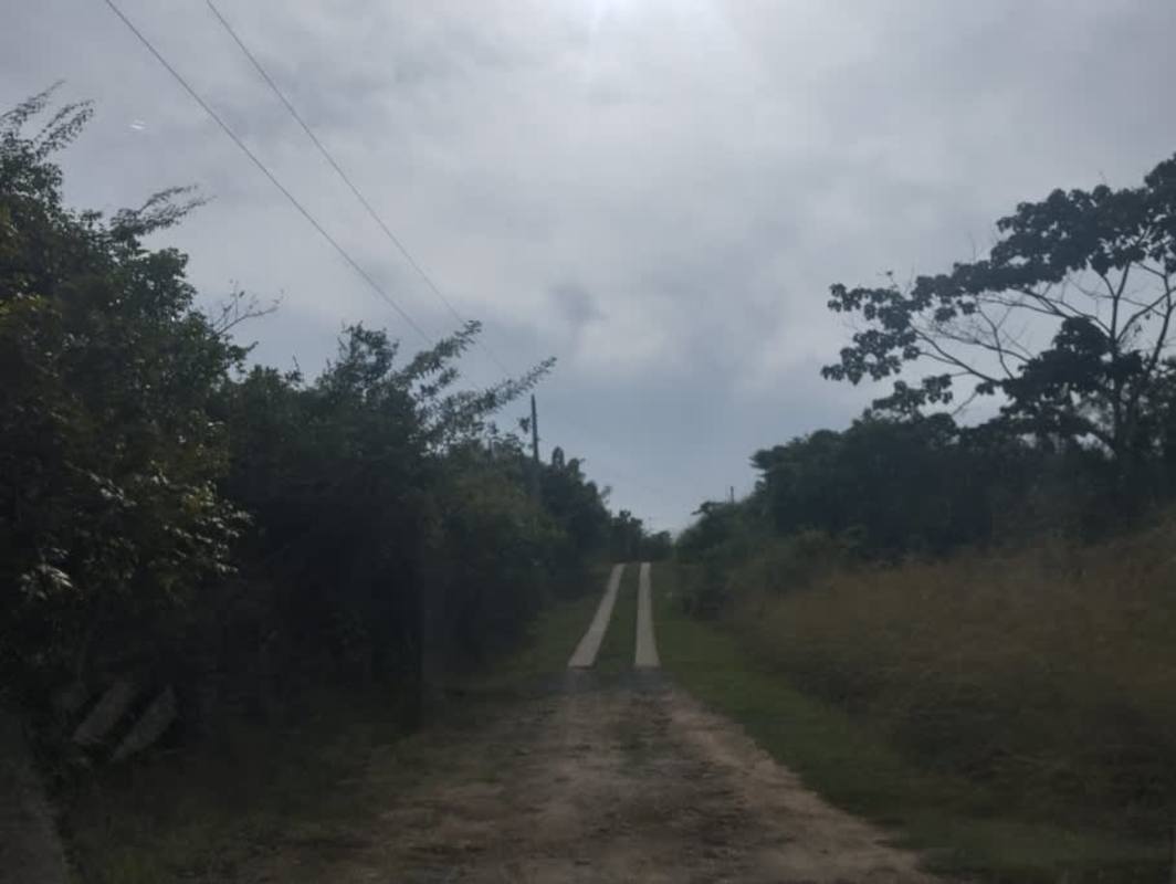 Mountain countryside dirt road with electrical lines La Tambora Capira Panama