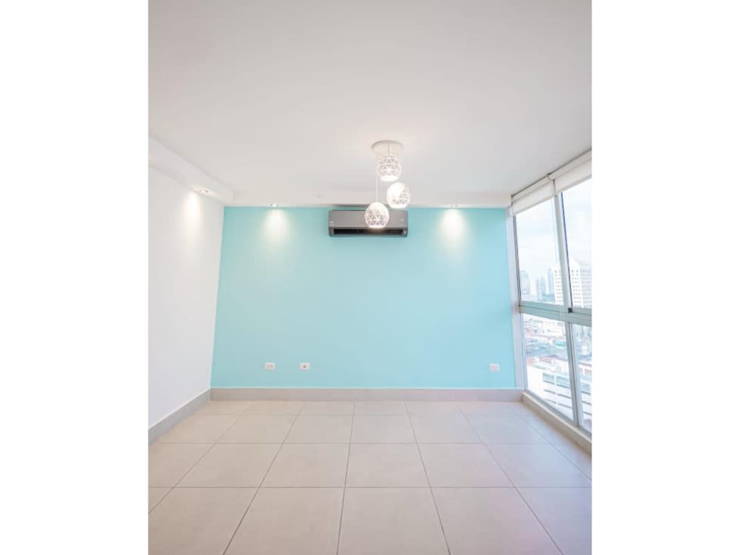 Modern kitchen with granite counters, appliances, light cabinetry in PH Park City Obarrio