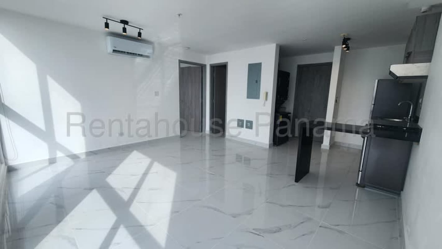 Open kitchen with granite counters, marble tile floors, large window at PH BICSA Tower Panama City