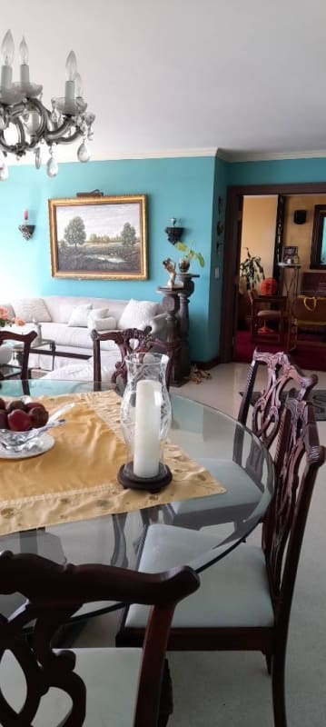 Dining and living room with panoramic ocean and city views through large windows in PH Mediterrane Junior Punta Paitilla Panama