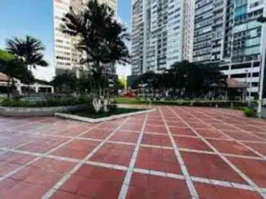 Modern high-rise condominiums with landscaped gardens and plaza in PH Central Park Panama City