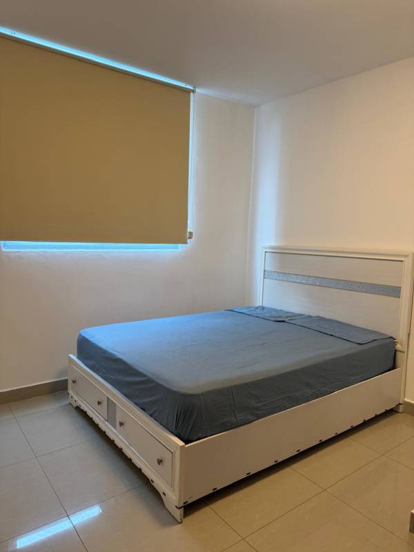 Simple bedroom with storage bed, tiled floor, roller shade at PH San Francisco Bay rental Panama