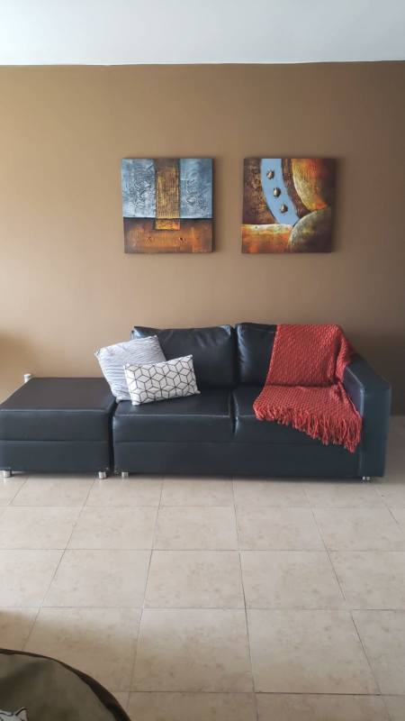 Fully furnished bedroom with AC unit and window in Cosmopolitan Tower apartment Panama