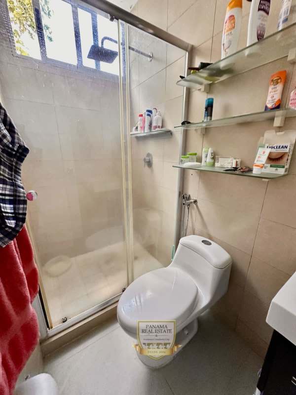 Bright master bedroom with window overlooking green areas PH Carrasquilla Plaza Panama