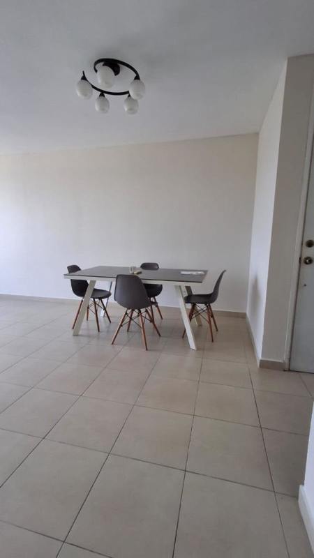 Kitchen with granite countertop, gas stove, oven, and window at PH Torres de Versalles Panama City