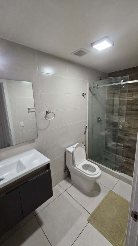 Modern bathroom with shower, tile, and vanity PH Coco Place Panama City