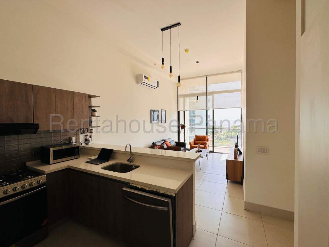 Kitchen with modern appliances and cabinetry in apartment PH Coco Place Coco del Mar