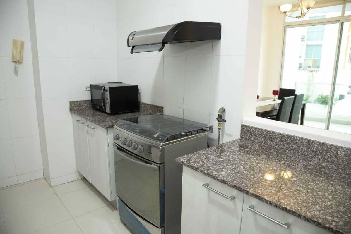 Spacious bedroom with built-in closet, window blinds and modern furniture Panama