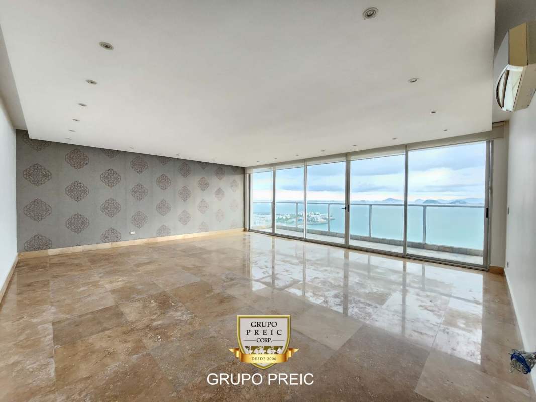 Spacious living area with panoramic ocean views from floor-to-ceiling windows PH Q Tower