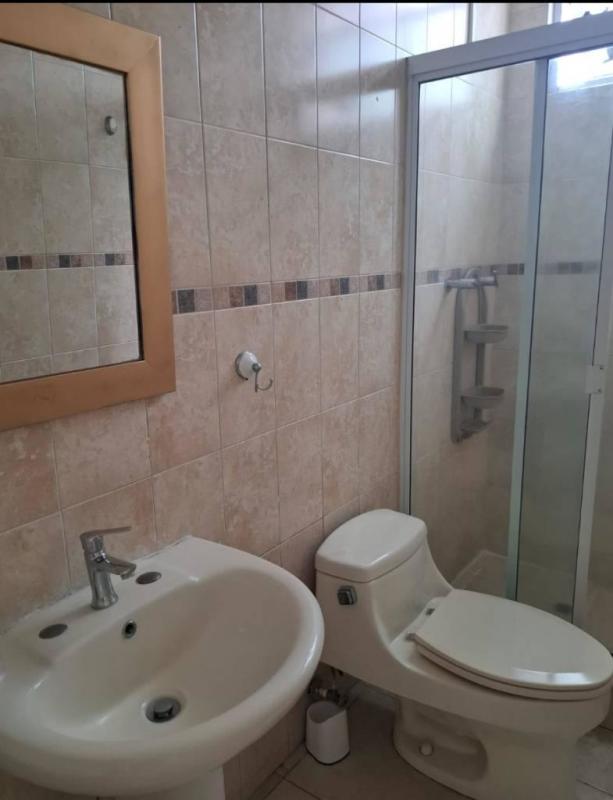 Contemporary bathroom with glass shower enclosure, ceramic sink in PH San Francisco Bay Panama