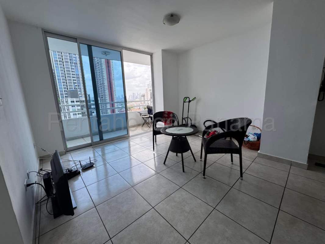 Modern living room with balcony access and city skyline views PH Sunshine Bella Vista Panama