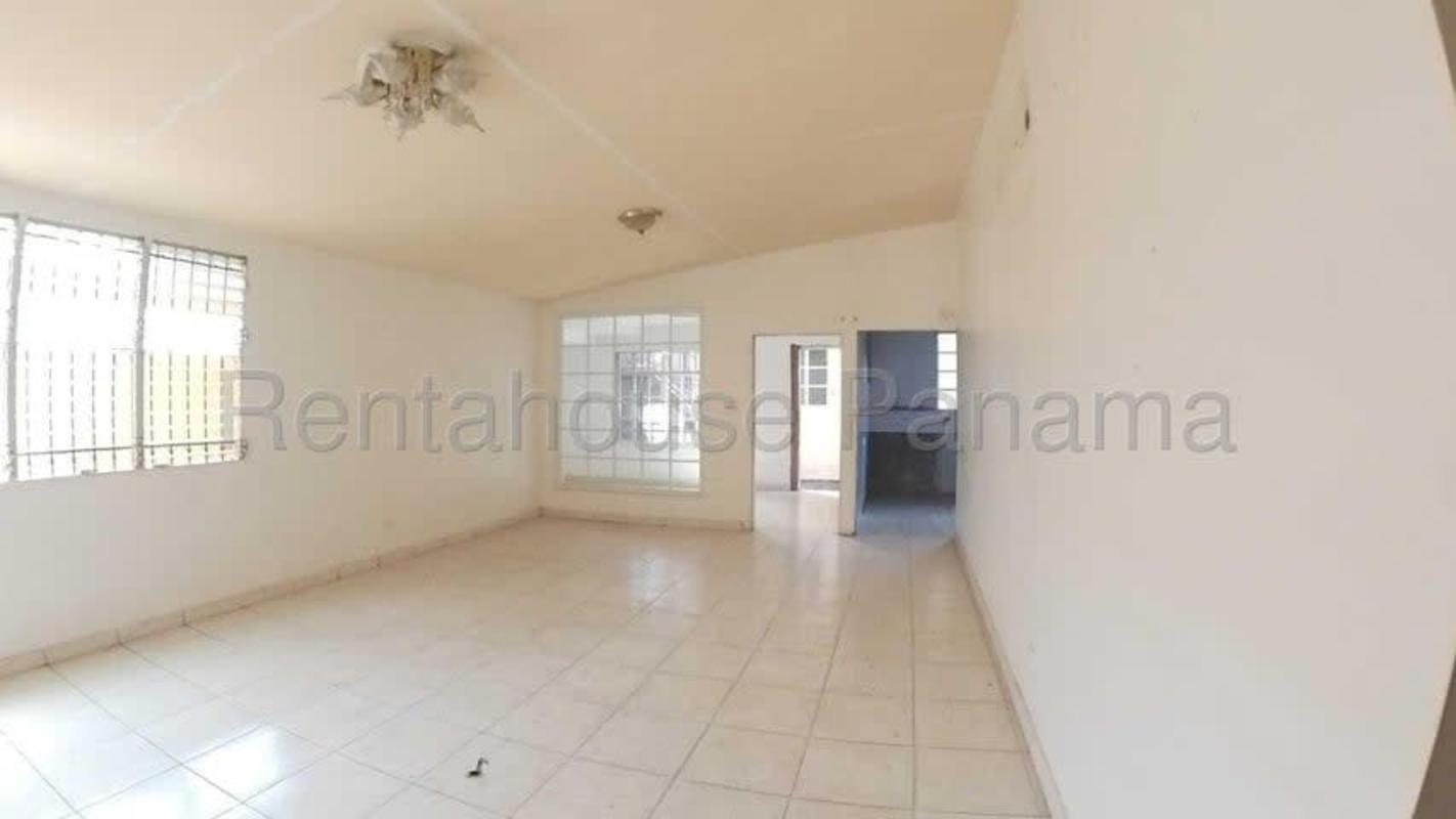 Minimalist spacious living room with tiled floors and large secure windows located Brisas del Golf Panama