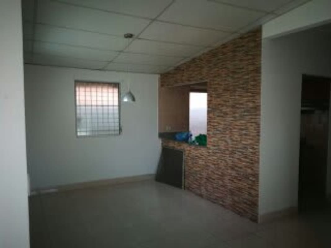 Open living and dining space with tiled floors in San Antonio house Panama City.