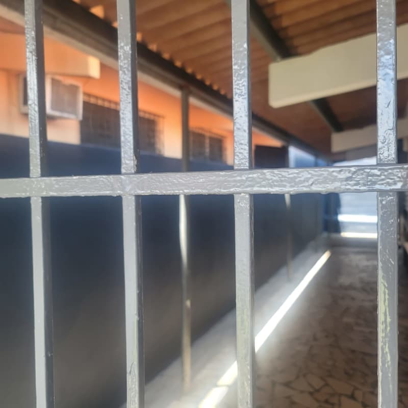 Covered walkway outside family rental house San Antonio Panama with security bars.