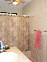 Rustic kitchen with island, arched windows, traditional tiles Sea Cliff Santa Clara