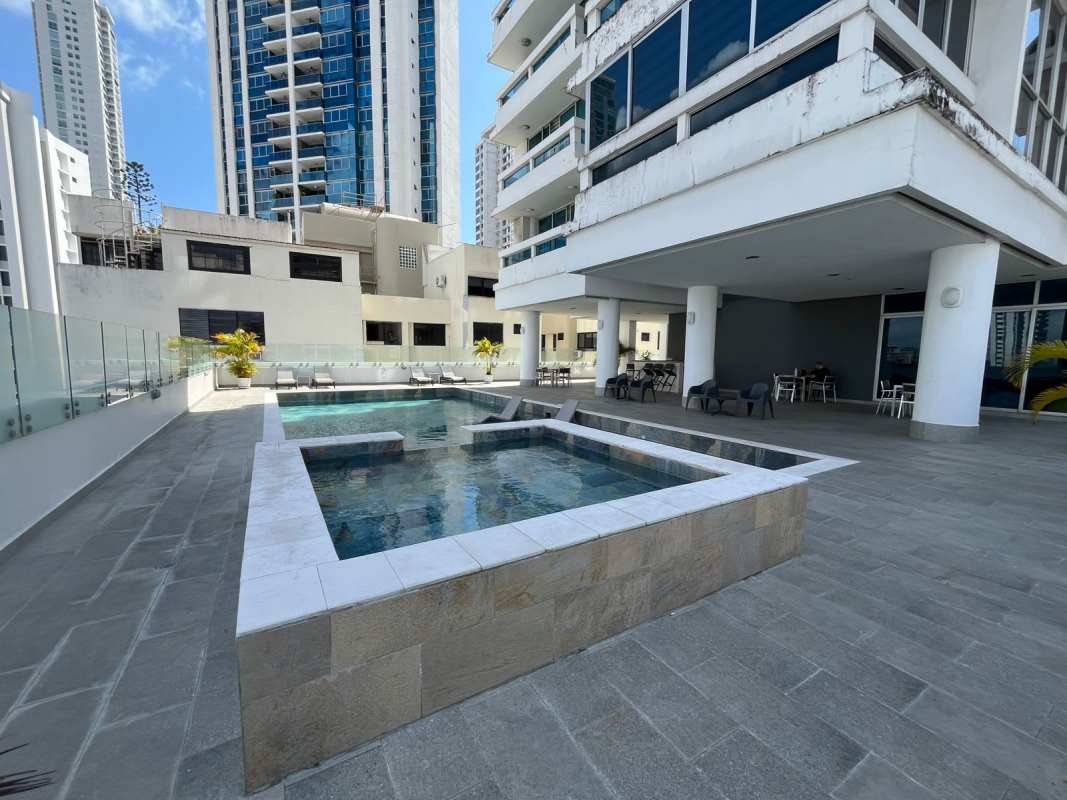 Outdoor pool with jacuzzi and sun lounge area PH The View San Francisco Panama