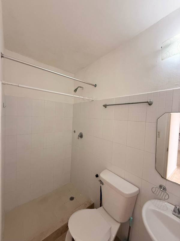 Bedroom with ventilation window safety mesh tile floors in Las Acacias rental apartment Panama