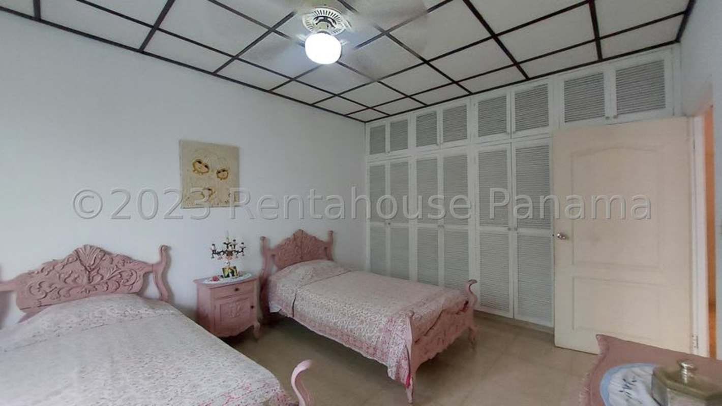 Traditional twin bedroom with built-in closets and pink decor luxury house Panama