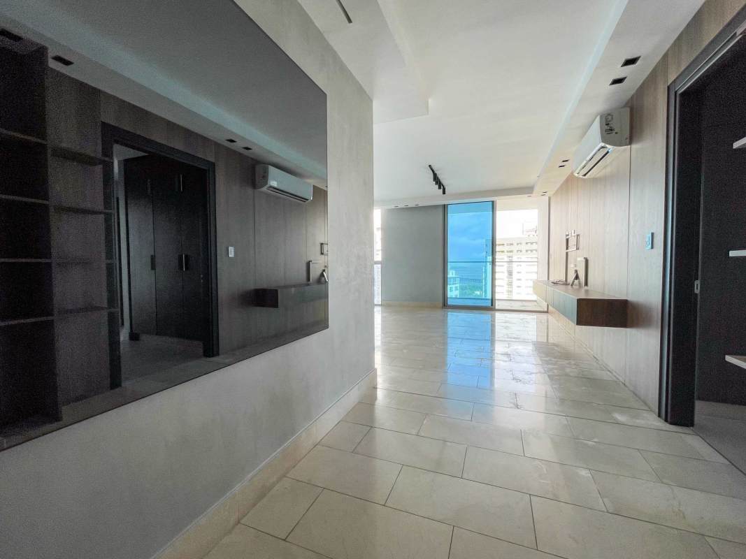 Luxury apartment living room with floor to ceiling windows and city-ocean views in PH Riviera del Mar Coco del Mar Panama