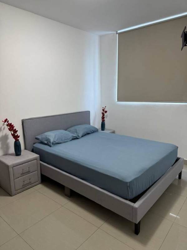 Apartment living room with balcony, stacked washer dryer, contemporary decor in PH Diamond Panama