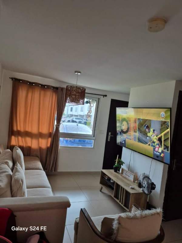 Contemporary living space sofa TV window PH Villasol El Crisol Panama rental house