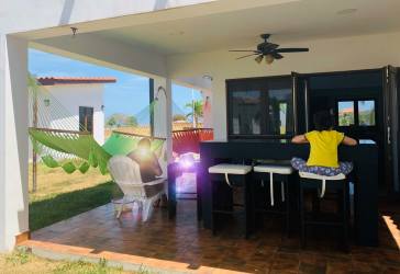 Wooden beachfront observation deck with palm trees overlooking Pacific Ocean at Las Tablas Los Santos beach house rental