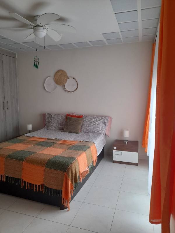 Bedroom with ceiling fan and colorful decor PH Torres de Versalles II Costa Sur Panama