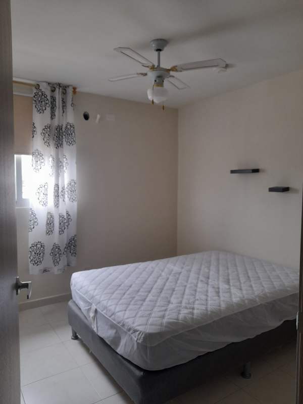 Clean bedroom with queen bed ceiling fan large window PH Torres de Versalles II Costa Sur Panama