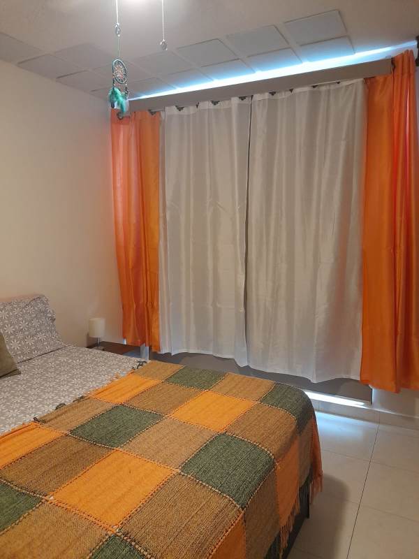 Bedroom with bright curtains ceiling fan bed PH Torres de Versalles II Costa Sur Panama