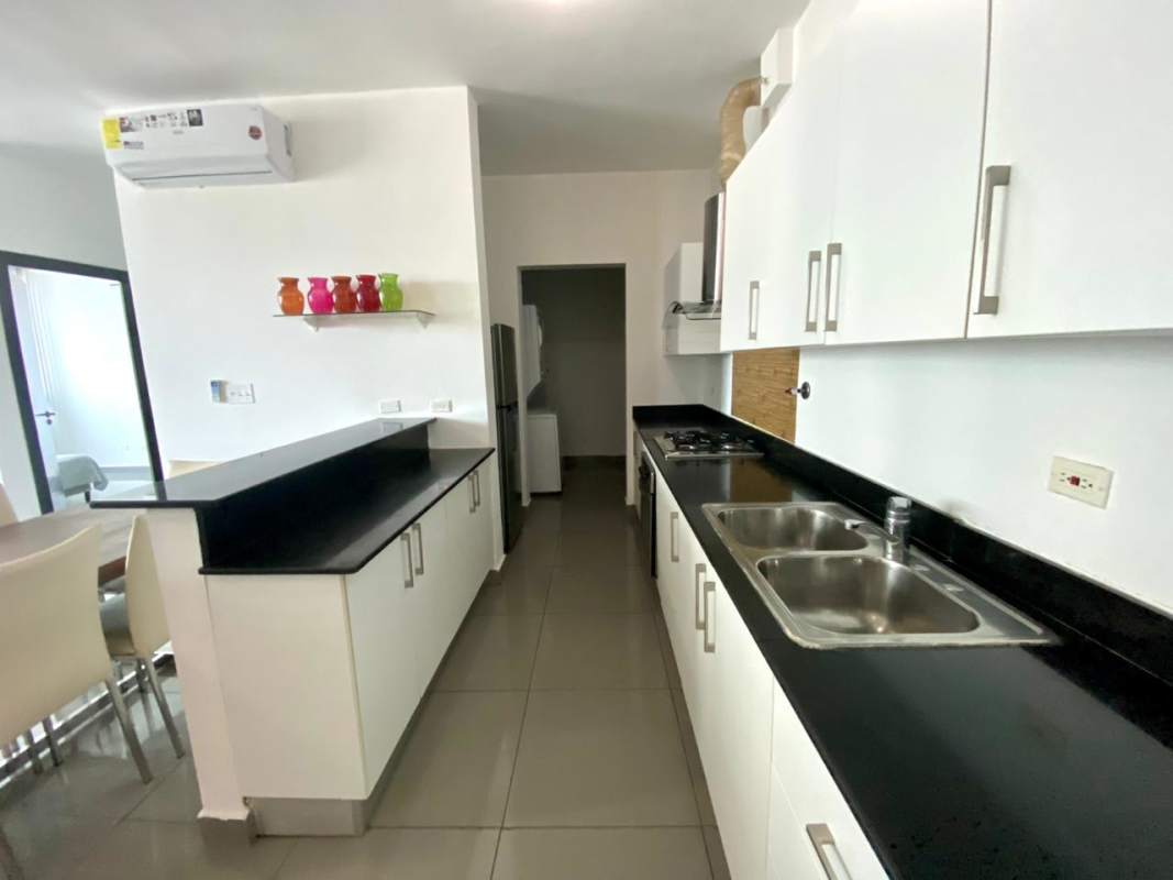 Furnished living room with city view windows PH Pacific Hills Panama